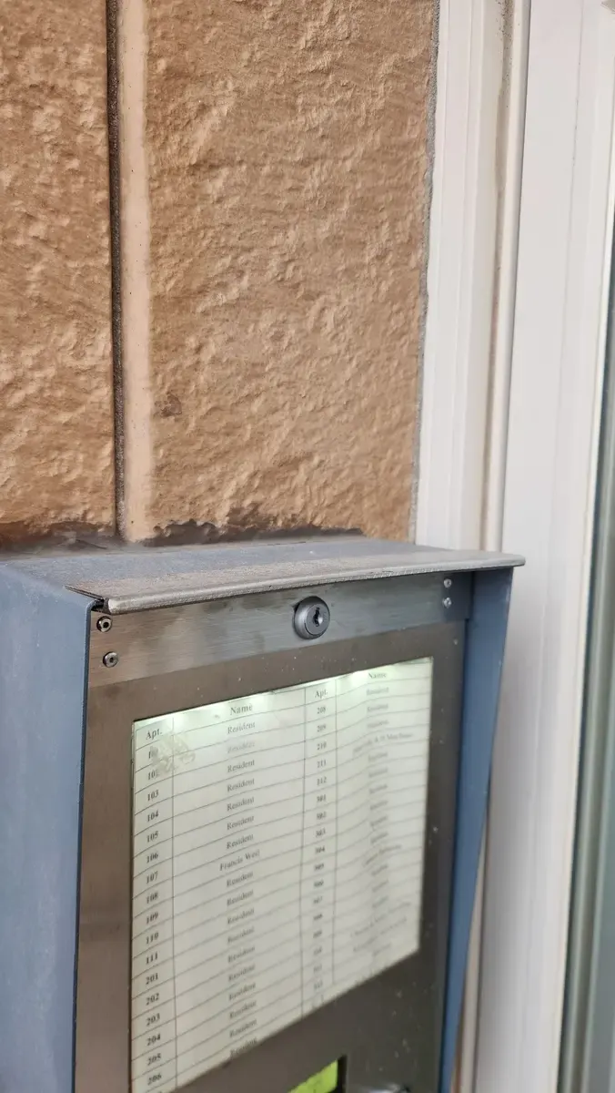 Custom stainless steel apartment mailbox directory panel with glass front