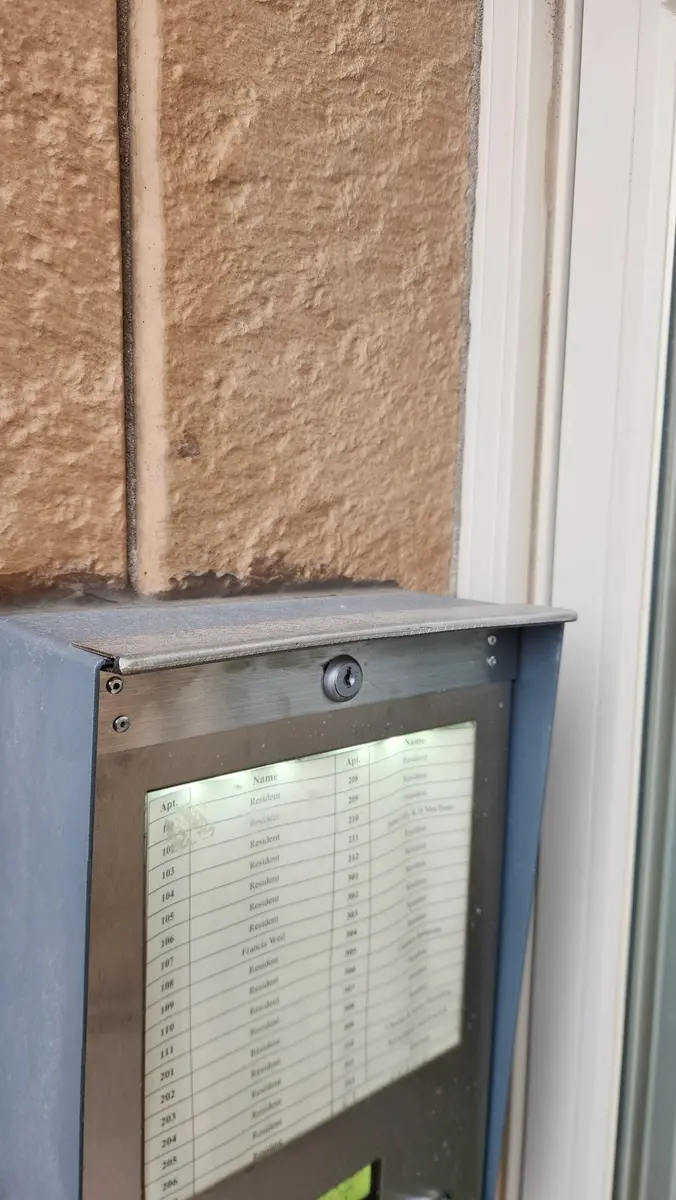 Custom stainless steel apartment mailbox directory panel with glass front