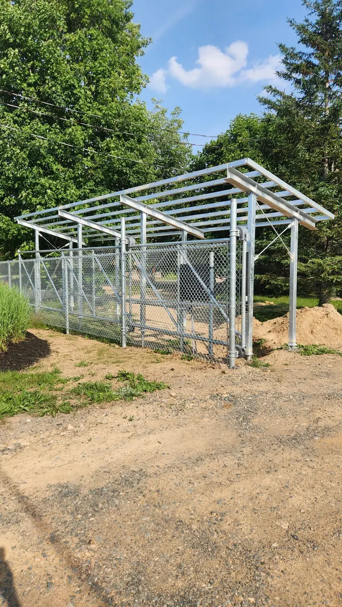 Galvanized steel shelter and chain-link enclosure structure outdoors