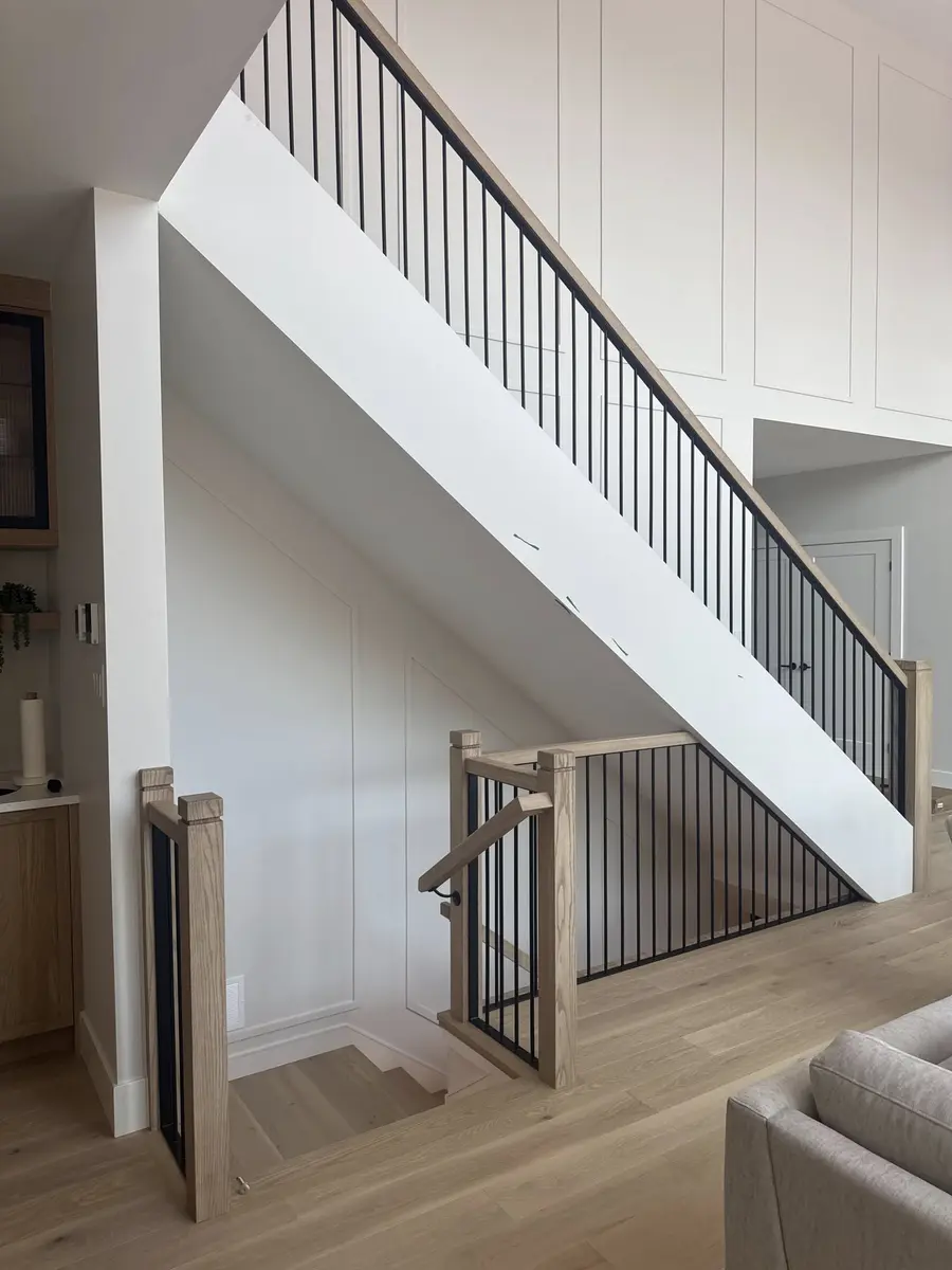 Interior commercial handrail mounted on wall in stairwell