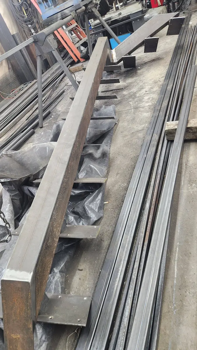 Stair stringer being fabricated in shop