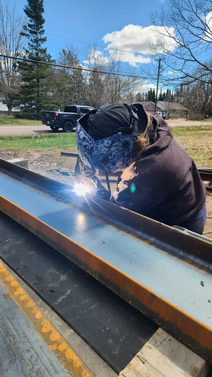 HEWS team member welding